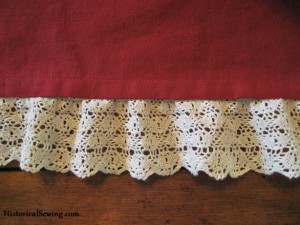 Hem with lace tacked on back