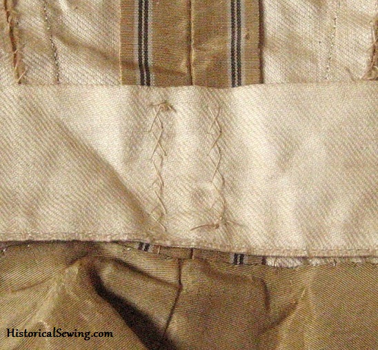 Original 1870s bodice with cross tacks holding the tape in place