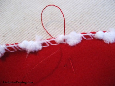 Thread loop over the top edge of the ribbon