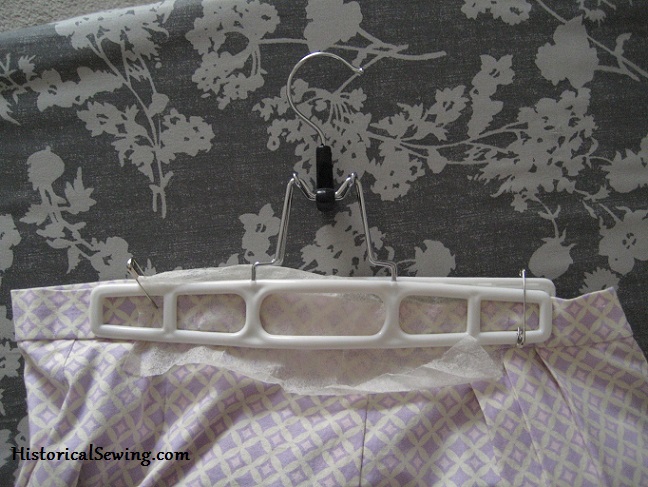 Skirt grip hanger with safety pins