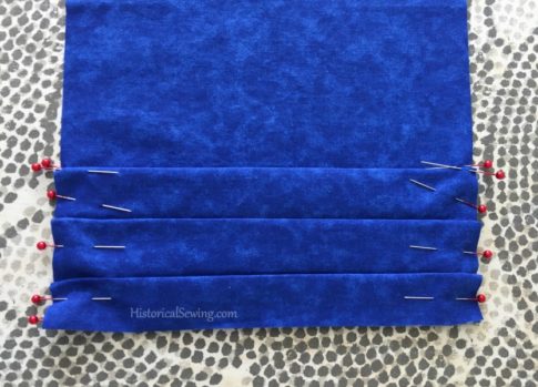 Pleats folded and pinned | HistoricalSewing.com